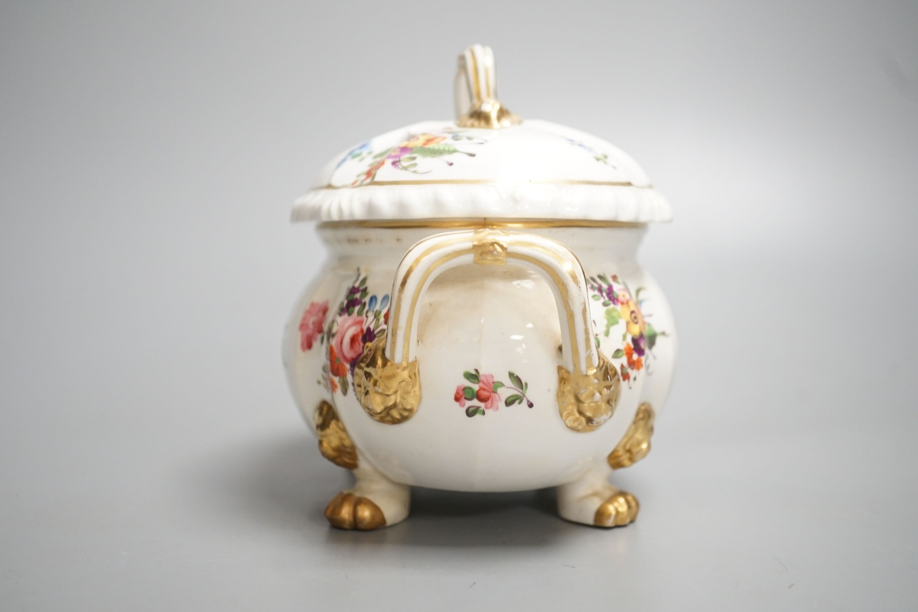 A Derby tureen and cover, early 19th century, on four feet with lion head masks painted with flowers, red mark, overall height 13.5cm